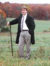 Standing in a field wearing a tie? Whaaa?